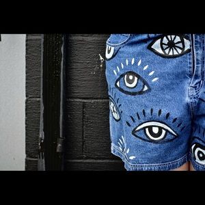 Jean shorts with hand painted eye design